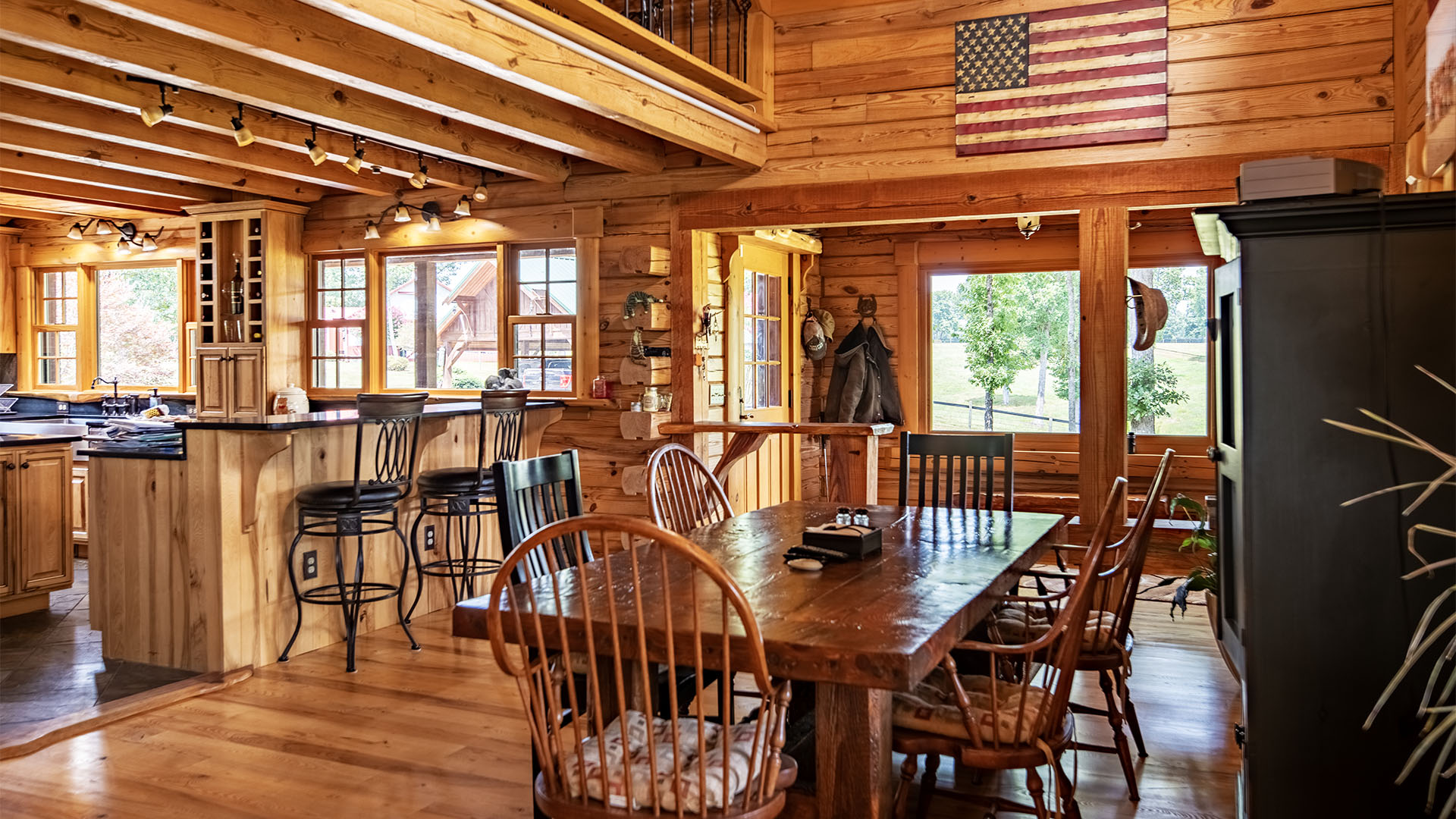 dining room open to kitchen in log home at Louisa County farm