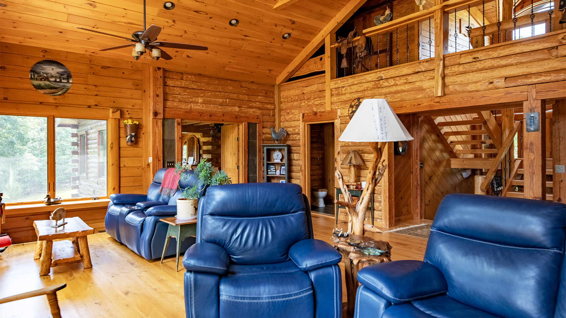 spacious living room in Virginia country home overlooking pond
